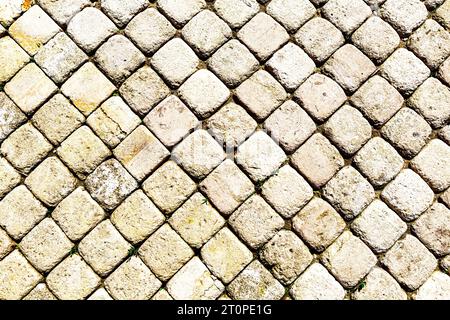 Square shaped stone paving slabs as a creative background, stone texture Stock Photo