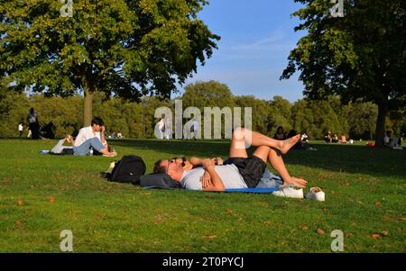 London, UK. 08th Oct, 2023. A couple enjoying the unusually warm sunshine in October in London's Hyde Park. Oct 8th 2023. Permissions/release granted. Credit: Mark York/Alamy Live News Stock Photo