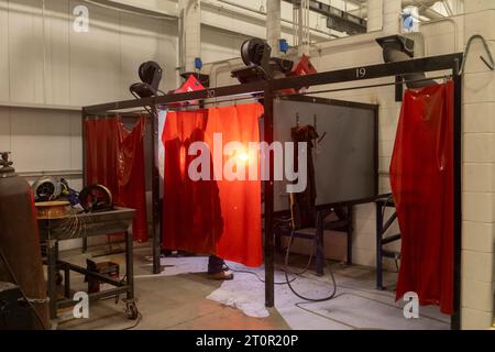 Detroit, Michigan - An apprentice works in a welding booth as carpenters and millwrights learn job skills at the Michigan Regional Council of Carpente Stock Photo
