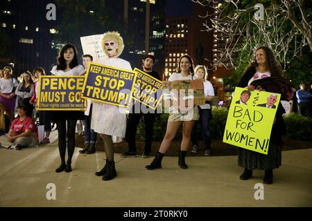 November 2, 2016 - Indianapolis, Indiana, USA: A transgendered women's rights activist, center, holds a sign reading, 'Keep America Great. Stop Trump!' Periods for Politicians formerly Periods for Pence stage an anti-Trump and anti-Pence The Revolution Will Be Uterized (A Rally in 3 Acts) on the steps of the Indiana Statehouse. Stock Photo