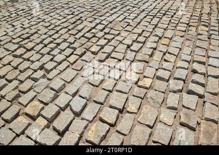 Cobblestones forming a background. Paving stones used in the streets of Brazil. Stock Photo