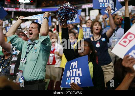07252016 - Philadelphia, Pennsylvania, USA: Hillary Clinton supporters cheer as delegates cast their votes during roll call on the second day of the Democratic National Convention. (Jeremy Hogan/Polaris) Stock Photo