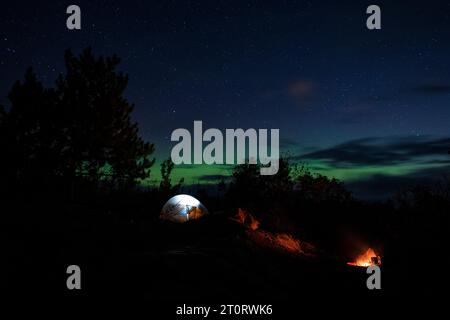 Northern Lights over a campsite in the Boundary Waters of northern Minnesota, USA Stock Photo