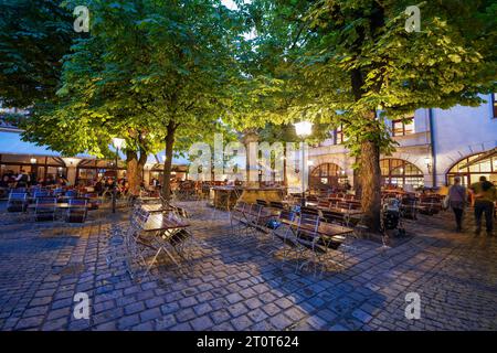 Munich, Germany, EU - Sept. 18, 2023. Hofbräuhaus München outdoor beer garden courtyard during Oktoberfest. Hofbrauhaus  Munich, a historic beer hall. Stock Photo