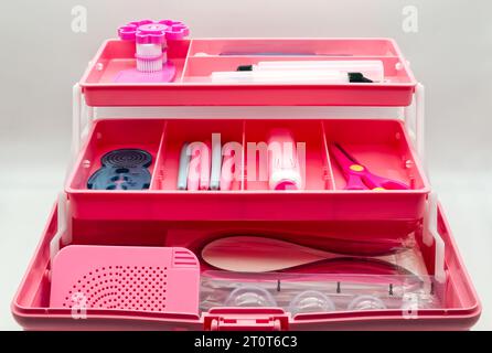 Quilling tool box isolated on white background. Pink box quilling kit. Stock Photo