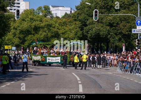 Munich, Germany, EU - September 16, 2023. Oktoberfest parade in Munich with floats, spectators in traditional German clothing, Dirndls and Lederhosen. Stock Photo