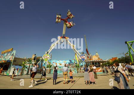 Munich, Germany, EU - Sept. 16, 2023. Oktoberfest Beer Festival Grounds with amusement park rides, beer tents and gardens with drinks, shops, parade. Stock Photo