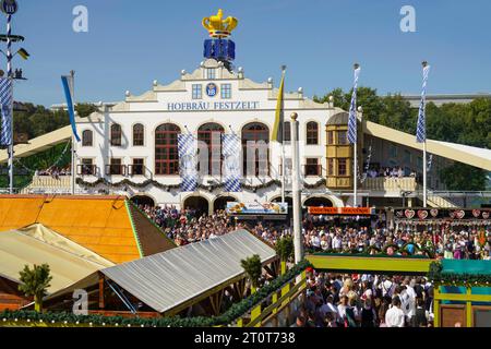 Munich, Germany, EU - September 16, 2023. Oktoberfest beer festival crowds, in traditional German clothes, during opening day parade at Theresienwiese Stock Photo