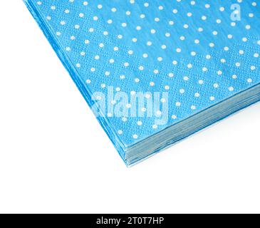 Stack of blue dotted paper napkins isolated on white Stock Photo