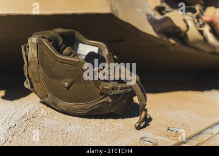 A military helmet lies on the ground. Modern equipment used in military. Open-air military parade. No people. High quality photo Stock Photo