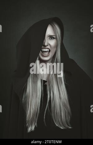 Black hooded female vampire Stock Photo