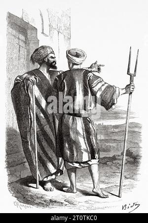 Two Inhabitants of Bethlehem. Travels in Palestine, 1856-1859. Old 19th century engraving from Le Tour du Monde 1860 Stock Photo