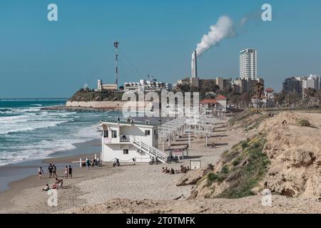 Gador Reserve Beach, Hadera, Israel, April 12; A view of the chimneys with smoke in the sky. Stock Photo