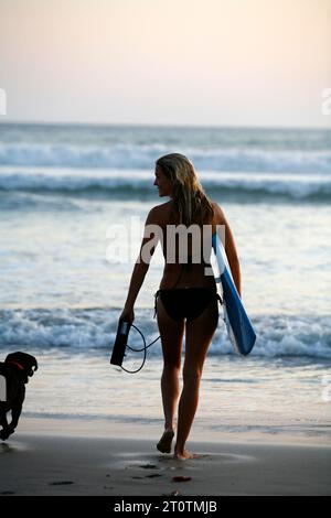Young woman surfer, Santa Teresa beach, Nicoya peninsula, Costa Rica. Stock Photo