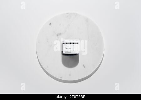 Strasbourg, France - September 2023: The Ordinary skincare brand by Deciem. Niacinamide Powder on marble circle white background. Clean minimalist hig Stock Photo