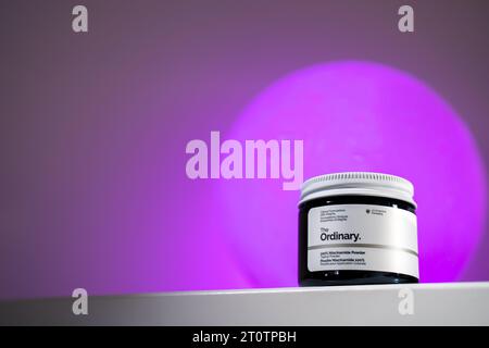 Strasbourg, France - September 2023: The Ordinary skincare brand by Deciem. Niacinamide Powder packaging against purple moon. Clean minimalist high ke Stock Photo