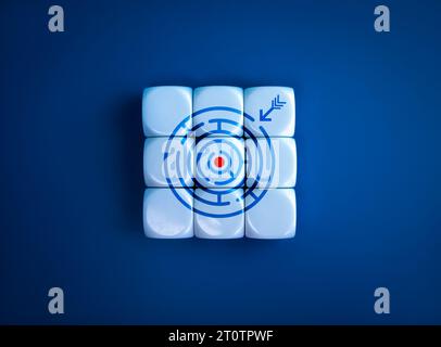 Target goal icon as a maze game symbol with arrow on completed white puzzle blocks on blue background. Business solution, planning to overcome obstacl Stock Photo