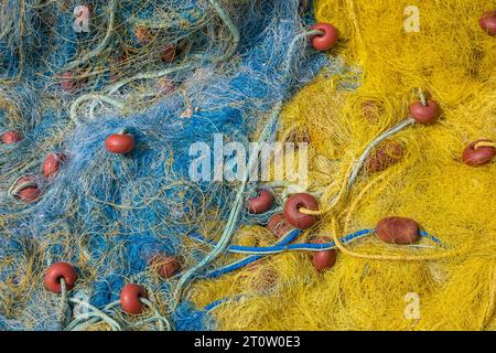 Kassiopi, Corfu, Greece - Colorful fishing nets in the harbor of Kassiopi, a small port town in the northeast of the Greek island Corfu Stock Photo