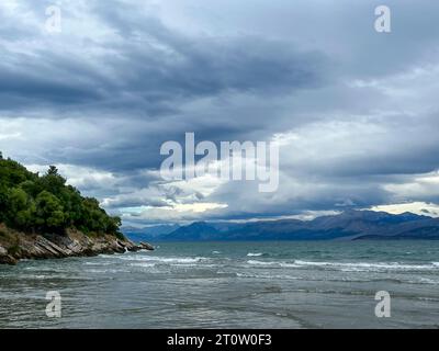 Kalamaki, Corfu, Greece - View from Kalamaki beach in the northeast of the Greek island Corfu over the Ionian Sea towards the mainland of Albania at t Stock Photo