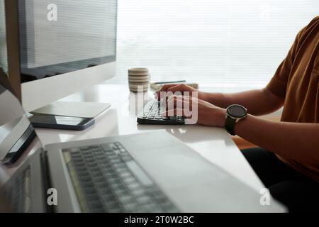 Hands of software developer coding in his home office Stock Photo