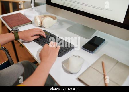 Cropped image of programmer reviewing code on computer screen Stock Photo