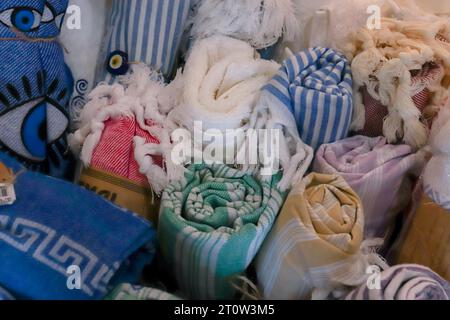 Colorful abstract background of different types of rolled fabrics with patterns Stock Photo