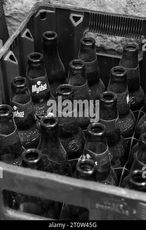 https://l450v.alamy.com/450v/2t0w45g/black-and-white-crate-full-with-open-and-empty-glass-bottles-mythos-beer-a-greek-beer-subsidiary-of-carlsberg-group-2t0w45g.jpg