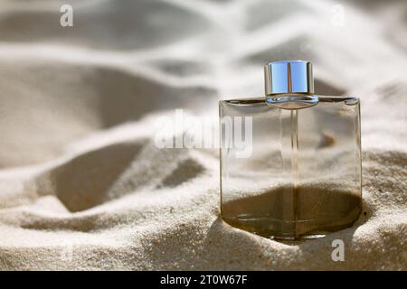 bottle of perfume on the sand Stock Photo