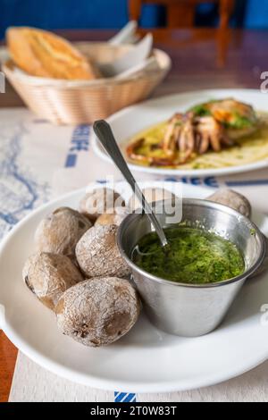 Papas arrugadas, wrinkled potatoes, in the traditional Canarian restaurant on Tenerife island, Spain. Stock Photo