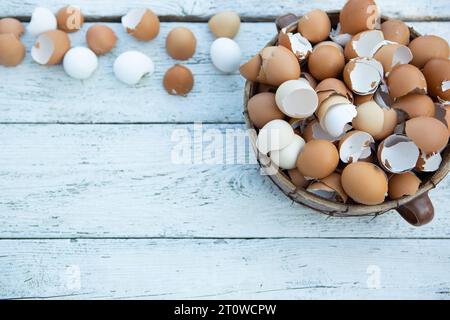 10 February 2023: Easter, broken eggs shells on light wood in a basket *** Ostern, zerbrochene Eier Schalen auf hellem Holz in einem Korb Credit: Imago/Ģ����ý Live News Stock Photo