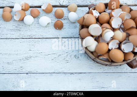 10 February 2023: Easter, broken eggs shells on light wood in a basket *** Ostern, zerbrochene Eier Schalen auf hellem Holz in einem Korb Credit: Imago/Ģ����ý Live News Stock Photo
