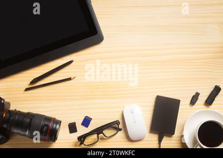 wood desk office with laptop, smartphone and other work supplies with cup of coffee. Top view with copy space for input the text. Designer workspace o Stock Photo