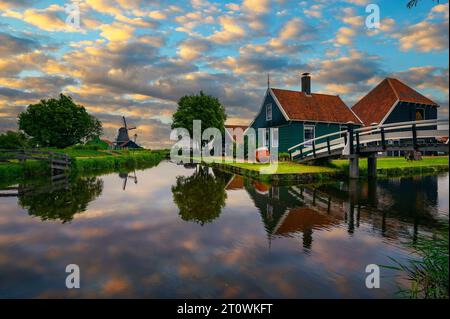 Sunset above historic farm houses in the holland village of Zaanse Schans Stock Photo