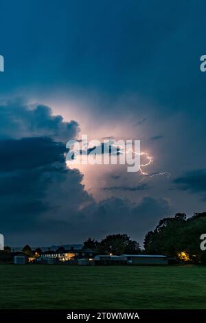 Thunderstorm with lightning striking over the small Welsh town of Presteigne, Powys, UK. Stock Photo