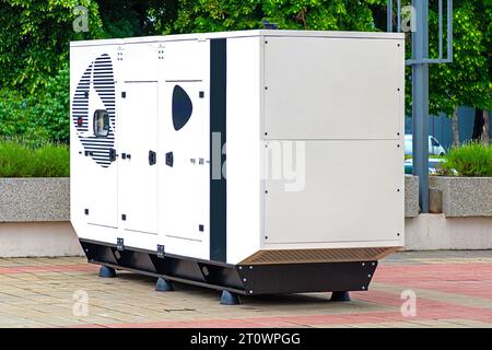 External electric power generator metal box outside on a field Stock Photo