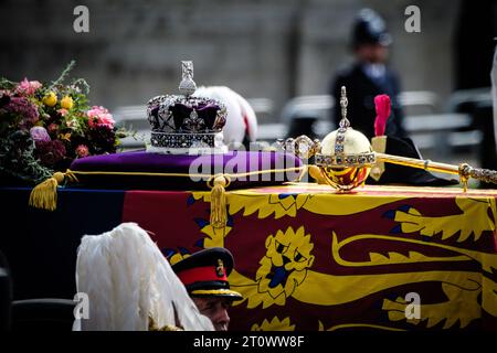 The coffin is adorned with the Royal Standard , Imperial State Crown and Septre photographed during the The State Funeral of Queen Elizabeth II at Buckingham Palace in London, UK on 19 September 2022 . Elizabeth's state funeral was the first held in Britain since Winston Churchill's in 1965. A funeral service was held at Westminster Abbey, followed by a procession to Wellington Arch that featured around 3,000 military personnel and was watched by around a million people in central London. Picture by Julie Edwards. Stock Photo