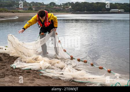 Berwick-Upon-Tweed, UK. 9th Oct, 2023. Environment Agency staff carry out a fish population survey on the estuary of the River Tweed. Using a boat and seine net, reminiscent of the traditional salmon fishing methods they catch, count, measure and release fish to help understand the local fish stocks. Credit: Julian Eales/Alamy Live News Stock Photo