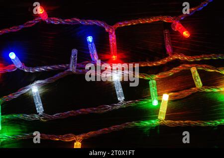 Multi-colored New Year's garlands with LED lamps on wires. New Year's decor Stock Photo