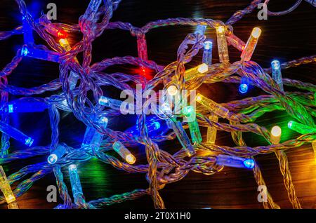 Multi-colored New Year's garlands with LED lamps on wires. New Year's decor Stock Photo