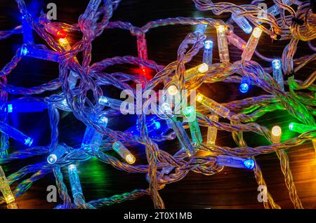 Multi-colored New Year's garlands with LED lamps on wires. New Year's decor Stock Photo