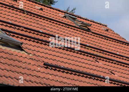 Aluminum profiles and wiring for the installation of solar panels on the roof of the house, installation of photovoltaic panels Stock Photo