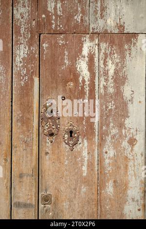 Wooden door. Nice texture of its surface. Old door furniture. Stock Photo
