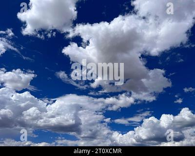 Perfect cumulus cloud cover in the desert near Taos New Mexico Stock Photo