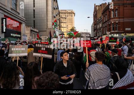 London, UK.  9 October 2023.  Palestine supporters at a demonstration outside the Embassy of Israel in High Street Kensington in an event organised by Stop The War coalition.  On 7 October, Hamas staged a surprise, multi-front attack from Gaza on Israel and, in response, the Israeli prime minister, Benjamin Netanyahu, has declared that Israel is at war and that Palestinians would 'pay a heavy price'.   Credit: Stephen Chung / Alamy Live News Stock Photo