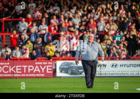 Football manager Steve Evans on pitch in front of fans and supporters whilst in charge at Stevenage Football Club Stock Photo