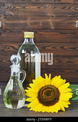 Sunflower oil on rustic wooden background Stock Photo