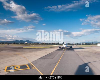 front view of a passenger jet airplane ready to take off on an airport runway Stock Photo