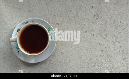 a photo of a cup of black coffee on a flat lay theme Stock Photo