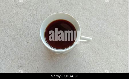 Photo of black coffee cup in a white mug on a white background Stock Photo