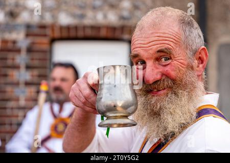 A Morris Dancer from The Brighton Morris Side Drinking Beer From A Traditional Tankard At The Annual 'Dancing In The Old' Event, Lewes, Sussex, UK Stock Photo